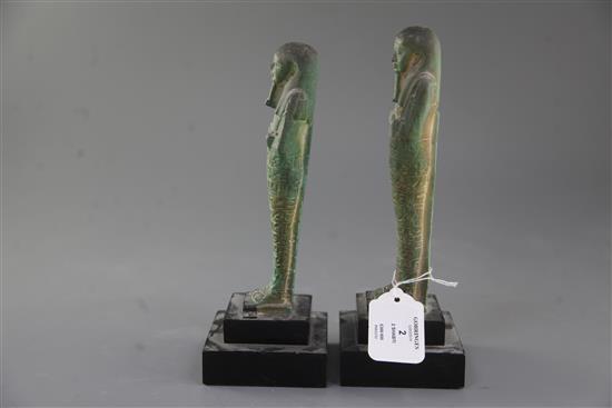 Two Egyptian green glazed composition Shabti, late period, 26th-30th dynasty, circa 664-332 B.C., 18.5 and 19cm excluding ebonised wood